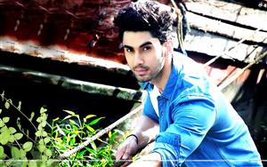 Dashing Lakshya Lalwani posing in a blue shirt